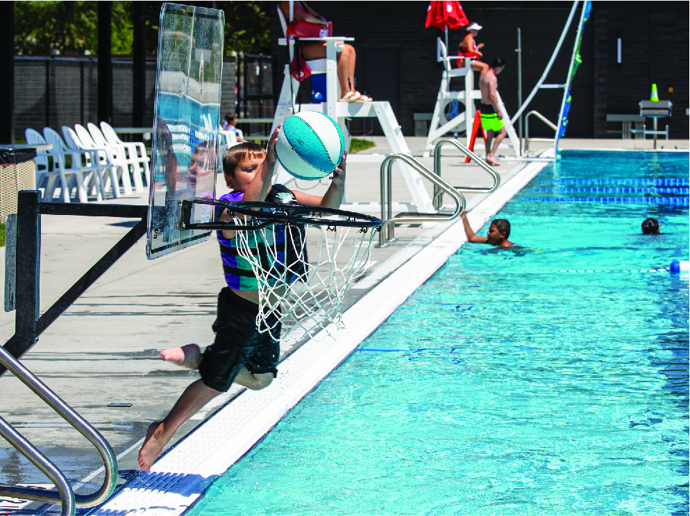 Boy with Basketball shooting hoop