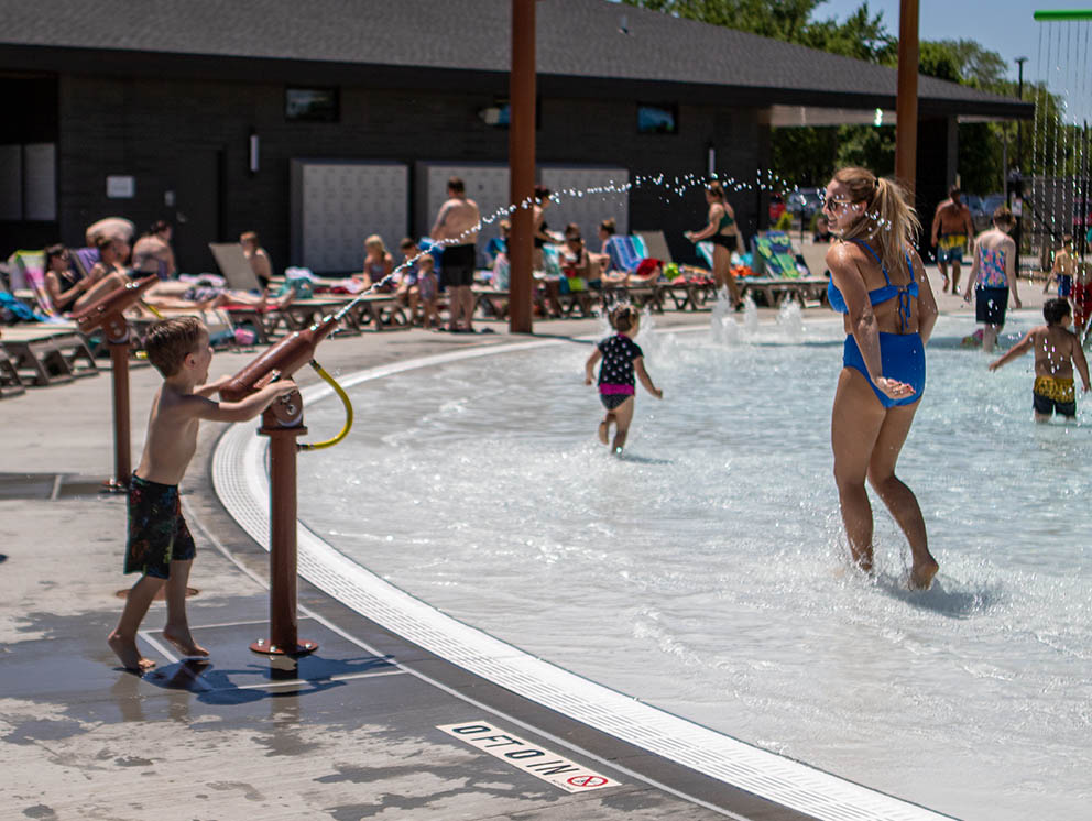 Boy playing with a water gun.